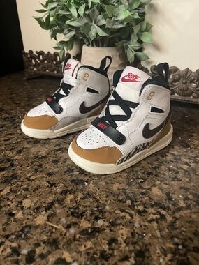 Nike Air Jordan’s baby White, Tan & Black High-Top Sneakers with Red Accents
